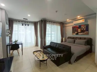 Spacious modern bedroom with elegant decor and natural light