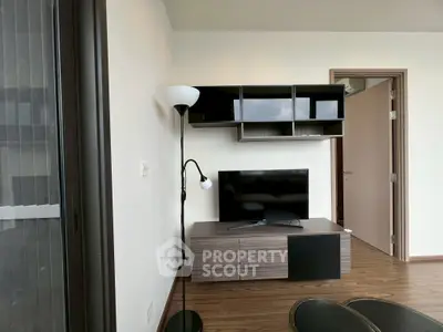 Modern living room with sleek TV stand and wall-mounted shelves