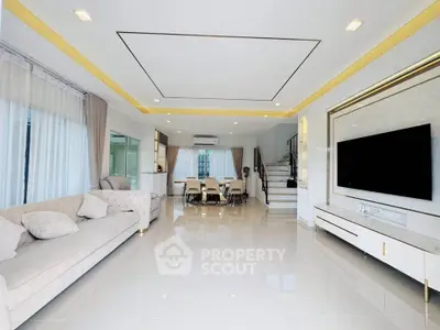 Spacious modern living room with elegant decor and large TV