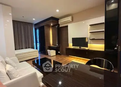 Modern living room with sleek furniture and integrated study area