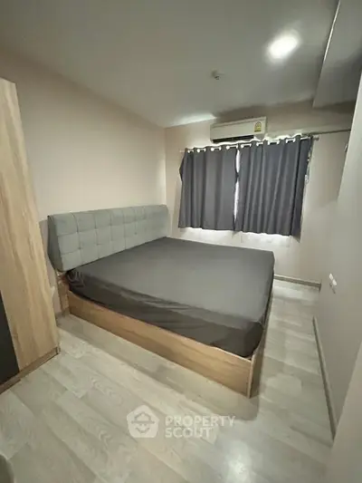 Cozy bedroom with modern bed and natural light