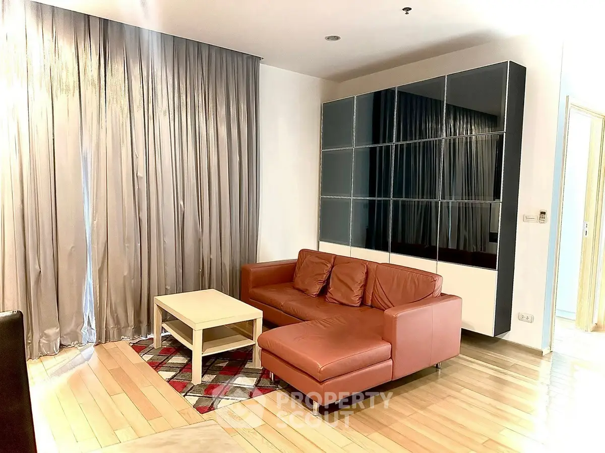 Modern living room with leather sofa and stylish decor