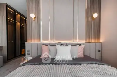 Luxurious modern bedroom with elegant lighting and plush bedding