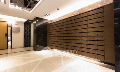 Luxurious apartment lobby with elegant mailboxes and marble flooring