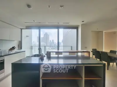 Spacious modern kitchen with city view and open layout in luxury apartment