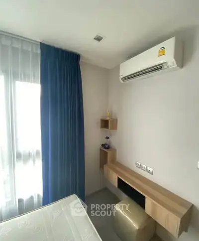 Modern bedroom with air conditioning and stylish decor