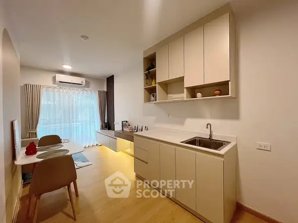 Modern open-layout kitchen with dining area and natural light