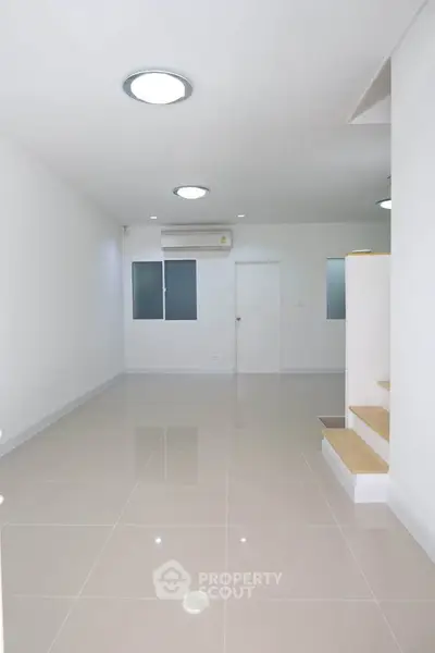 Spacious modern interior with sleek tile flooring and minimalist design