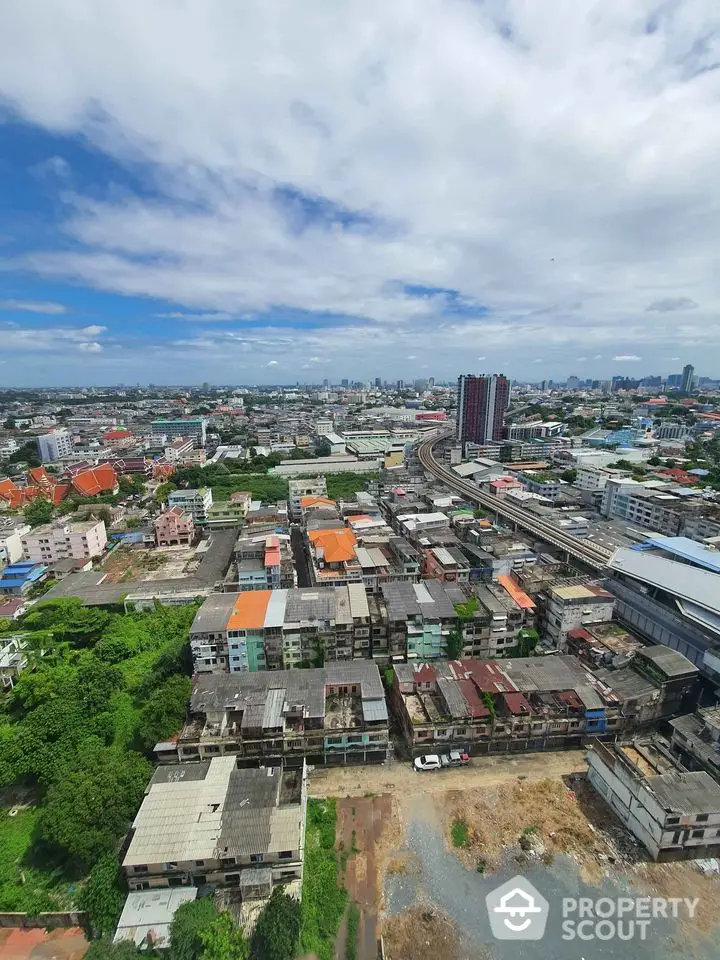 Stunning aerial view of urban landscape with residential buildings and city skyline.