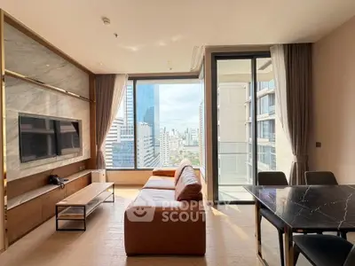 Luxurious living room with stunning city view and modern furnishings in high-rise apartment.