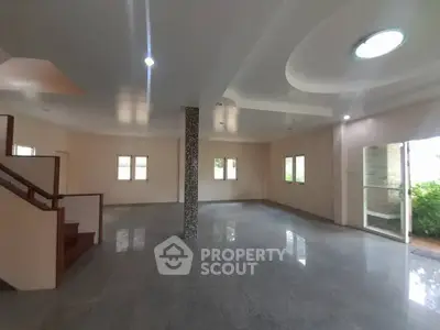 Spacious open-plan living area with modern design and ample natural light.