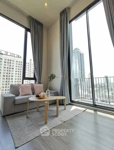 Spacious living room with floor-to-ceiling windows and stunning city view