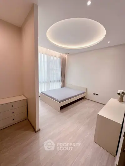 Modern minimalist bedroom with sleek design and soft lighting