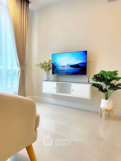 Modern living room with sleek TV setup and elegant decor