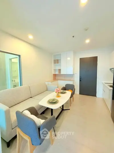 Modern living room with cozy sofa and dining area in a bright apartment