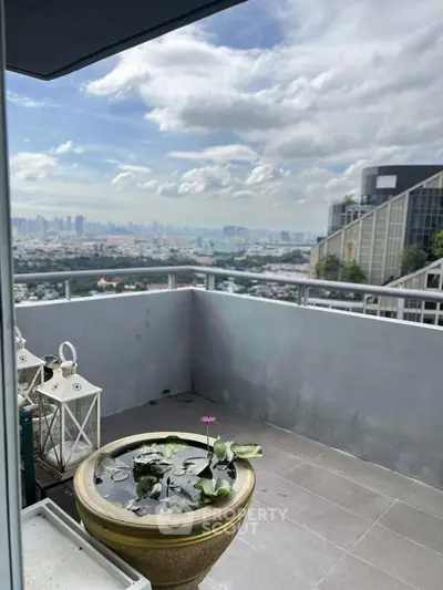 Stunning balcony with panoramic city view and elegant decor, perfect for relaxation and enjoying the skyline.