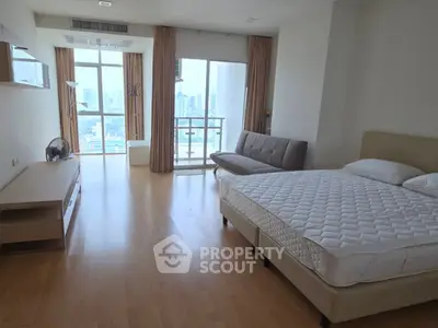 Spacious bedroom with city view and modern furnishings