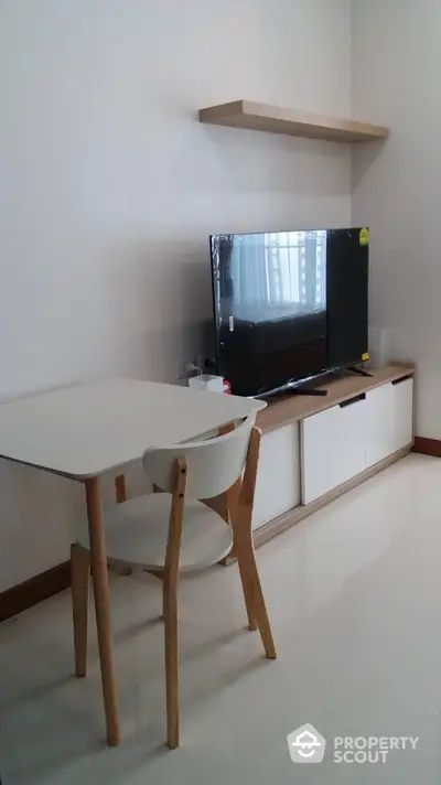 Modern living room with sleek TV unit and minimalist furniture design