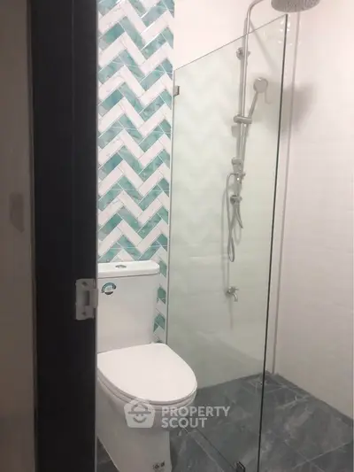 Modern bathroom with glass shower and stylish tile design