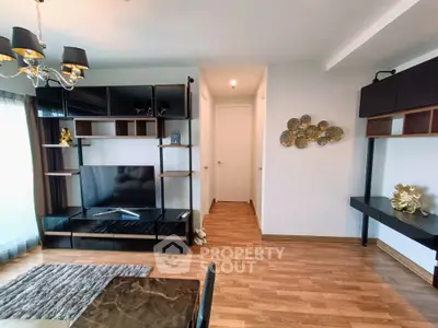 Modern living room with stylish decor and wooden flooring