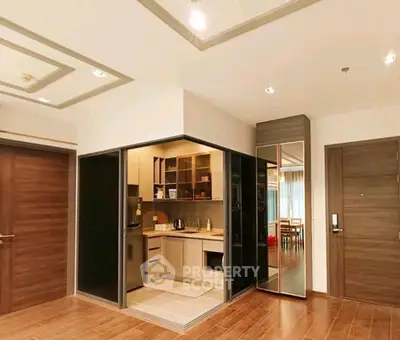 Modern kitchen with sleek design and open layout in a stylish apartment.