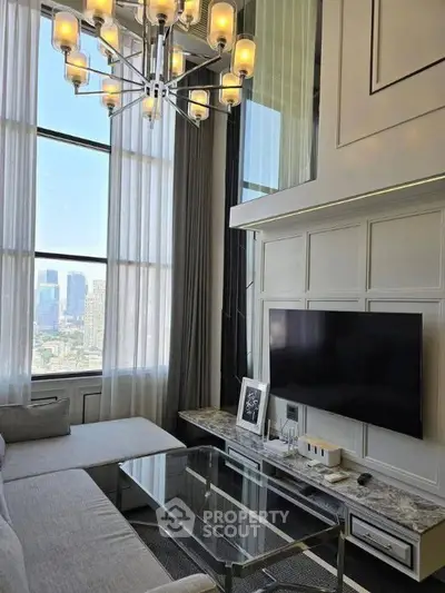 Luxurious high-ceiling living room with city view and elegant chandelier