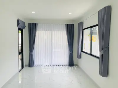 Bright and airy living room with modern curtains and large windows