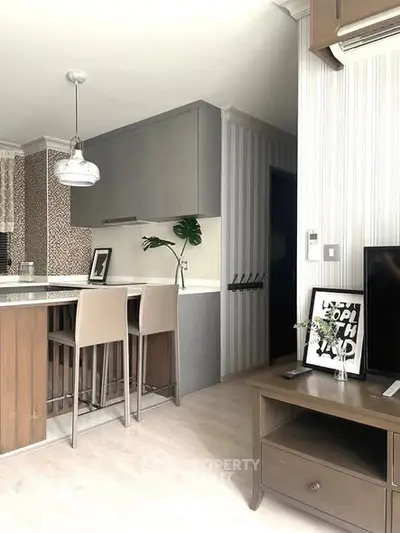 Modern kitchen with open layout and stylish decor in a contemporary apartment.