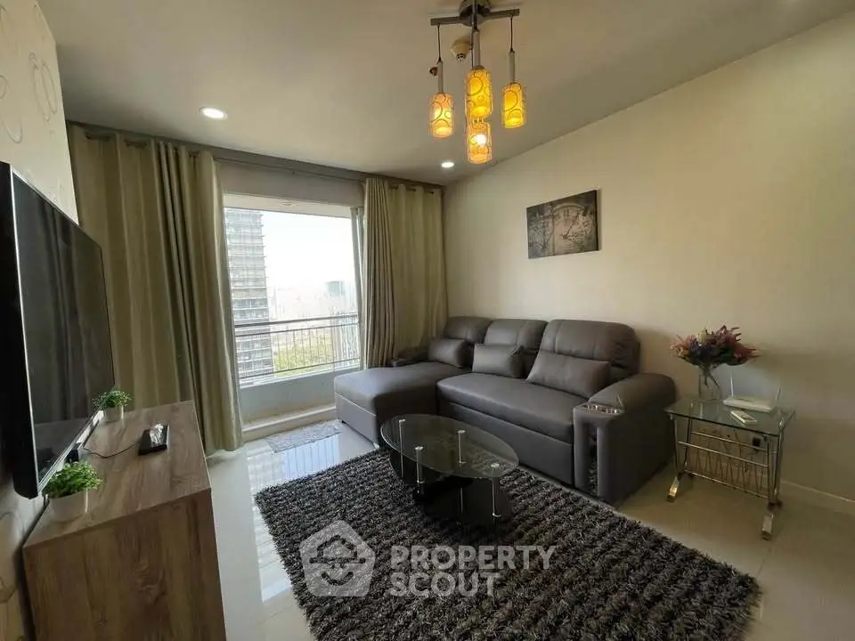 Modern living room with sleek furniture and city view balcony
