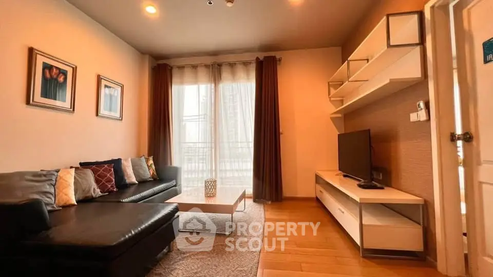 Modern living room with stylish decor and natural light, featuring a cozy sectional sofa and sleek entertainment unit.