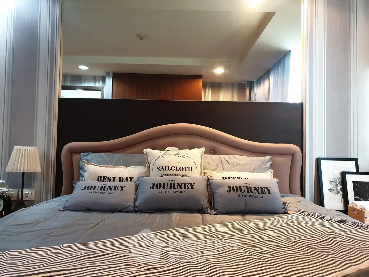 Luxurious bedroom with elegant decor and plush bedding