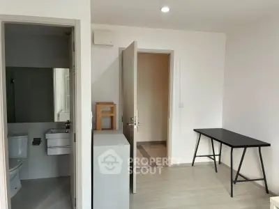 Modern minimalist apartment interior with study area and bathroom