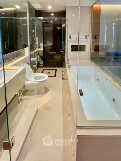 Luxurious modern bathroom with glass shower and large bathtub