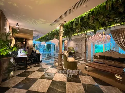 Luxurious living room with elegant decor and lush greenery accents