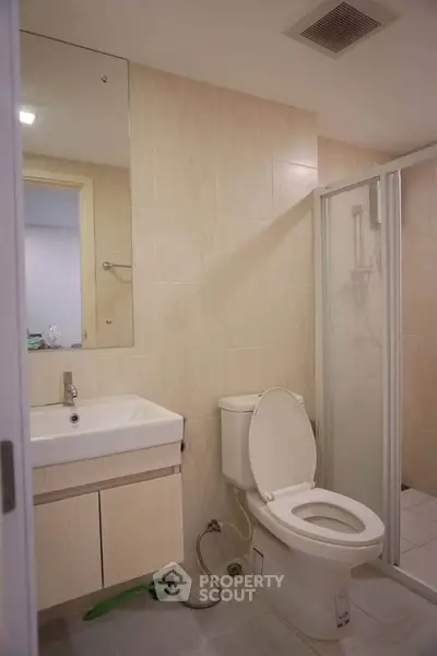 Modern bathroom with shower and vanity in a contemporary apartment