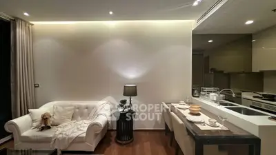 Modern living room with elegant sofa and dining area in open layout apartment