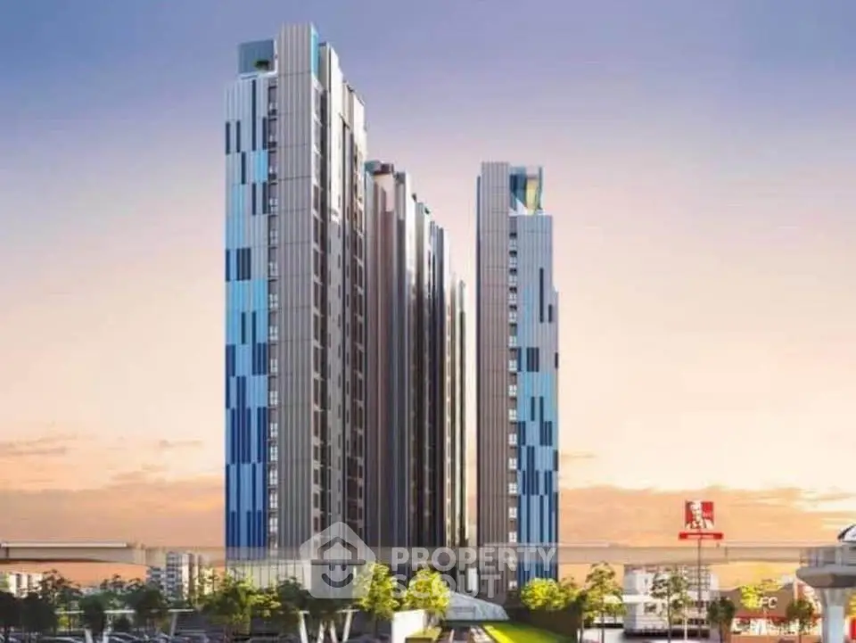 Modern high-rise building with sleek design and urban surroundings.