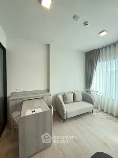 Modern living room with stylish furniture and natural light