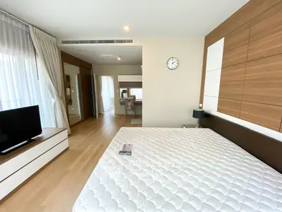 Spacious modern bedroom with elegant decor and natural light