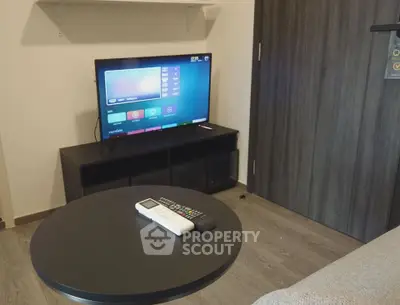 Modern living room with sleek TV setup and stylish furniture