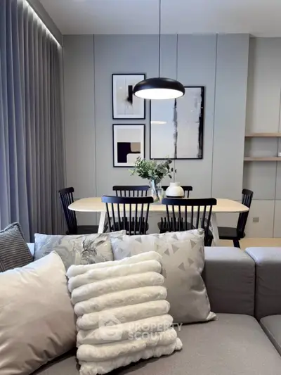 Modern living room with elegant dining area and stylish decor