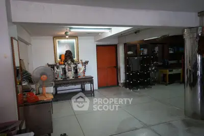 Spacious interior with traditional decor and ample storage space, ideal for versatile use.