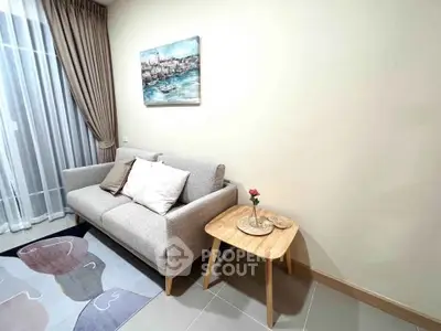 Cozy living room with modern sofa, stylish rug, and elegant decor in a bright, inviting space.