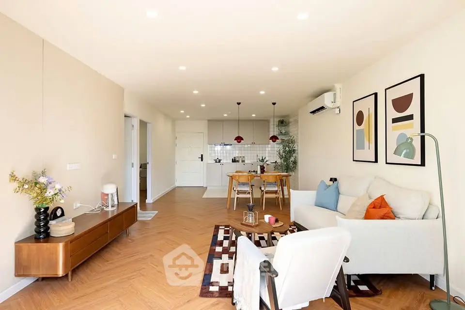 Spacious modern living room with stylish decor and open kitchen layout