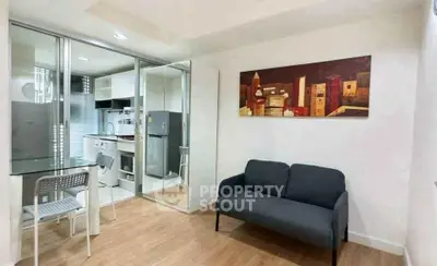 Modern apartment interior with cozy living room and sleek kitchen design.