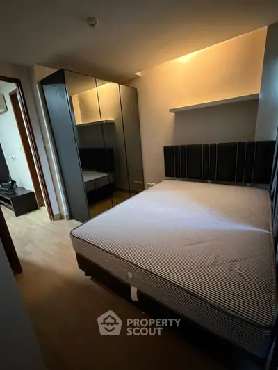 Cozy bedroom with modern wardrobe and stylish lighting