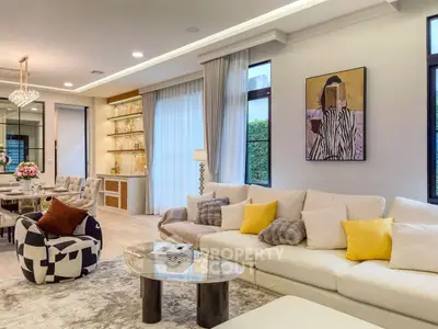 Luxurious living room with modern decor, plush seating, and elegant lighting, perfect for entertaining.