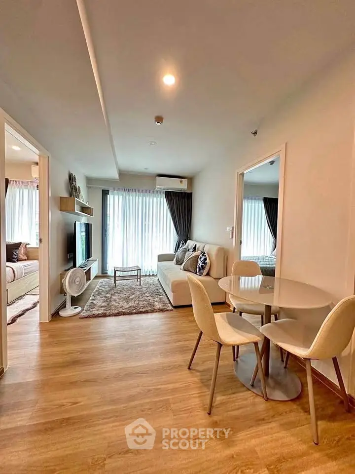 Modern living room with cozy dining area and natural light