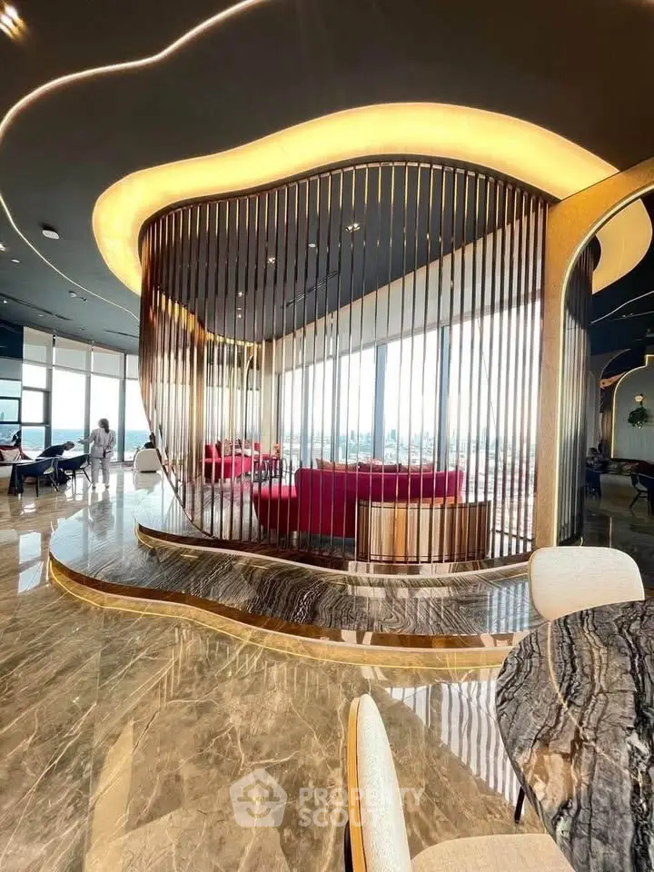 Luxurious modern living room with elegant design and panoramic windows offering stunning views.