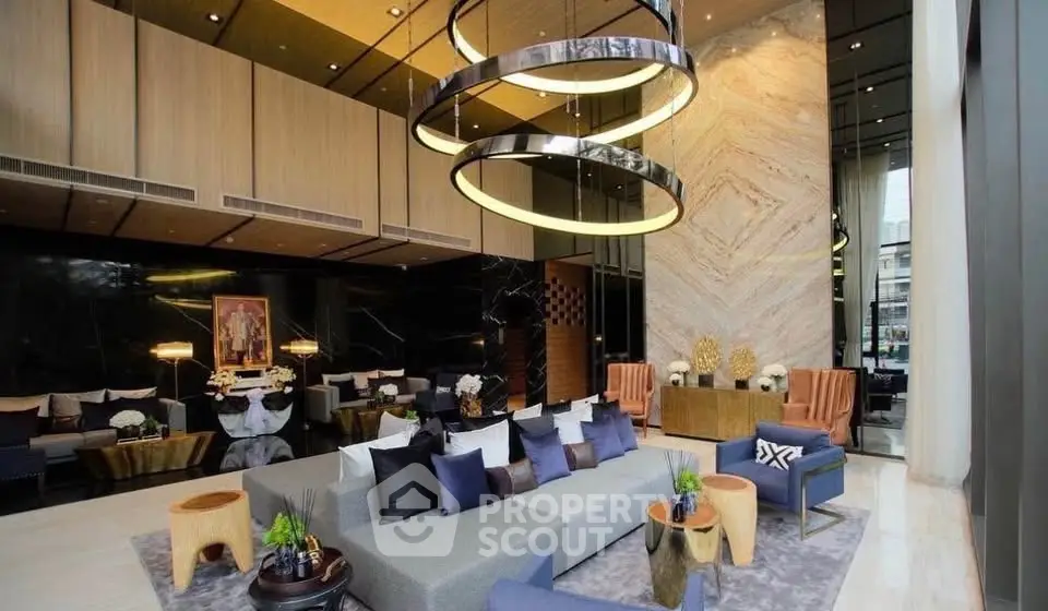 Luxurious modern living room with high ceilings and elegant decor in a premium real estate property.